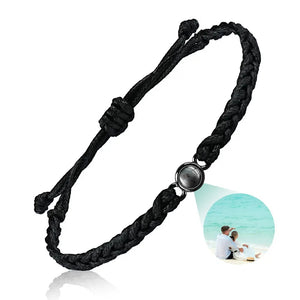 Black braided cord photo projection bracelet with round stone showing a couple photo