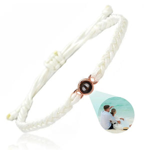 White braided photo projection bracelet with a rose gold setting and couple photo