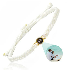 White braided photo projection bracelet with a gold setting and couple photo