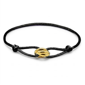 Black cord bracelet with a gold clasp on a white background