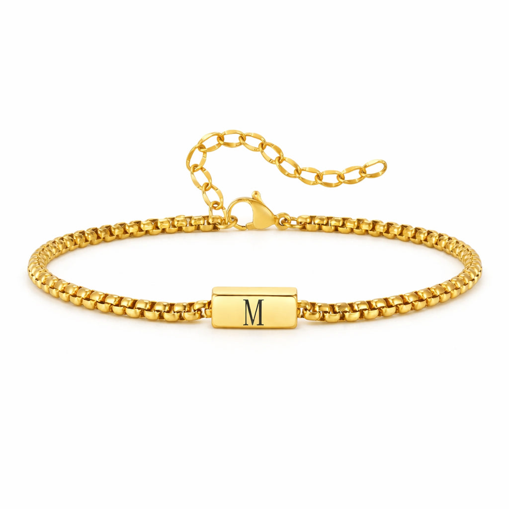Gold box chain bracelet with an initial bar engraved with the letter M