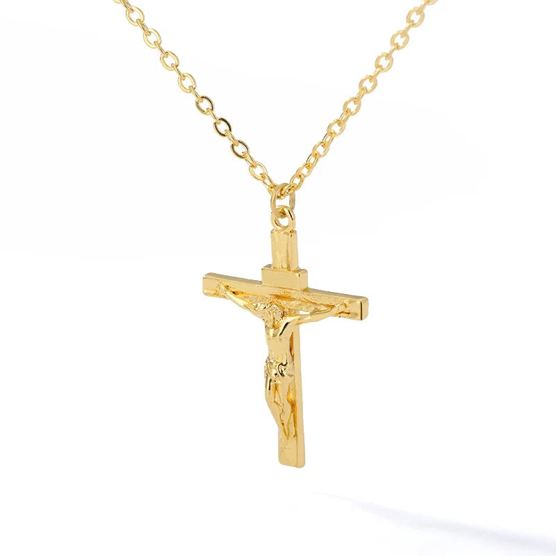 Gold Christian cross necklace with a crucifix pendant on a cable chain