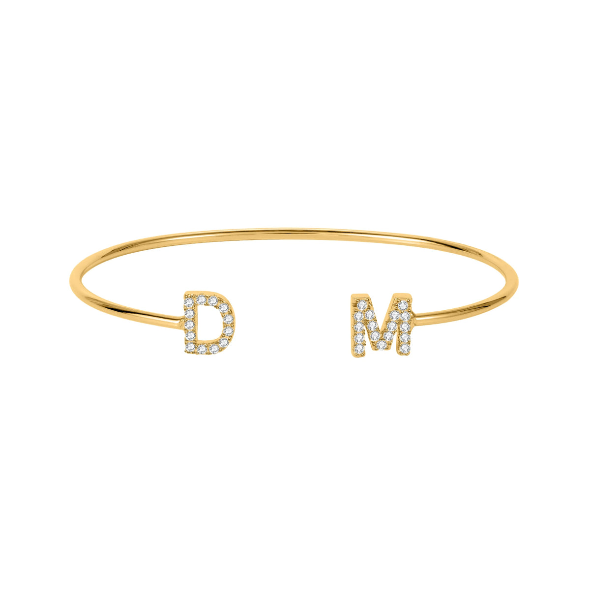 Gold dainty double initial cuff bracelet with the letters D and M in sparkling stones