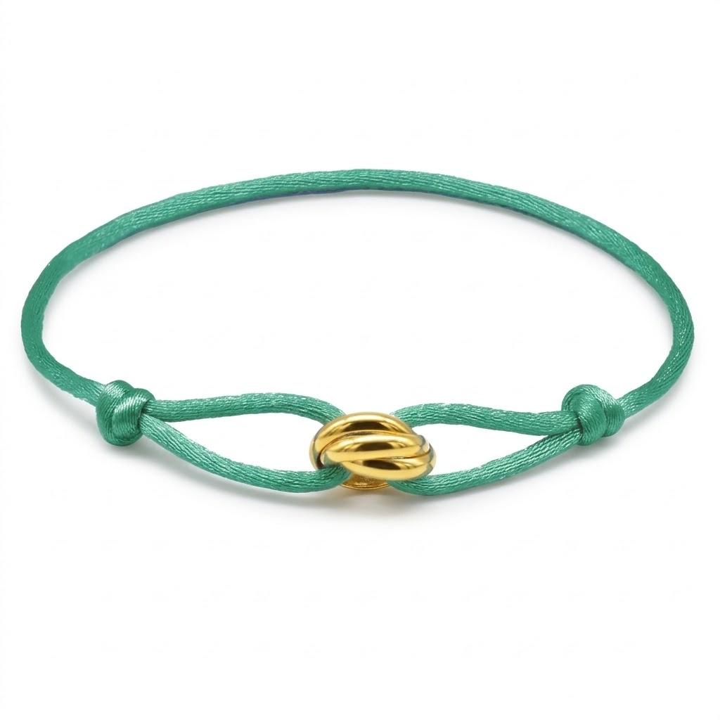 Jade bracelet with a gold clasp on a white background