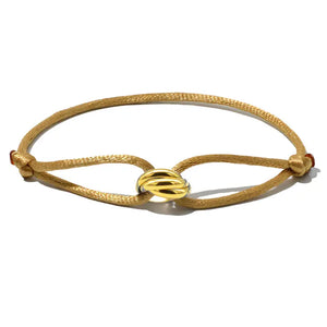 Khaki beaded rope bracelet with a gold knot design on a white background