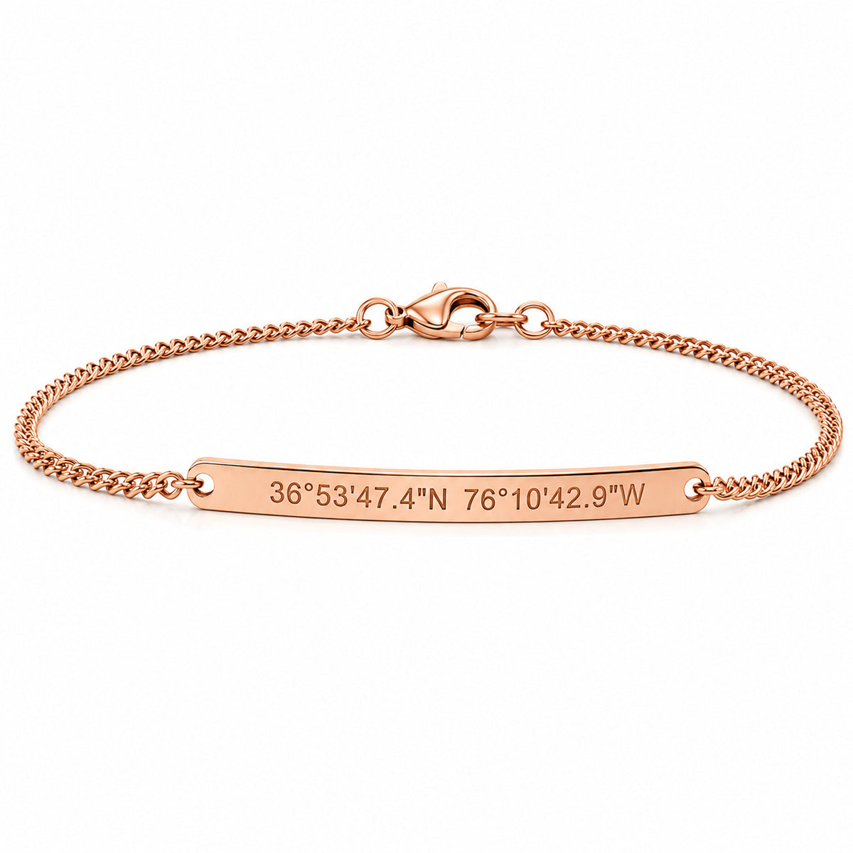 Rose gold engraved bar bracelet with coordinates on a curb chain