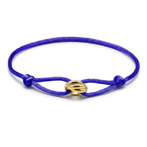 Sapphire bracelet with a gold clasp on a white background