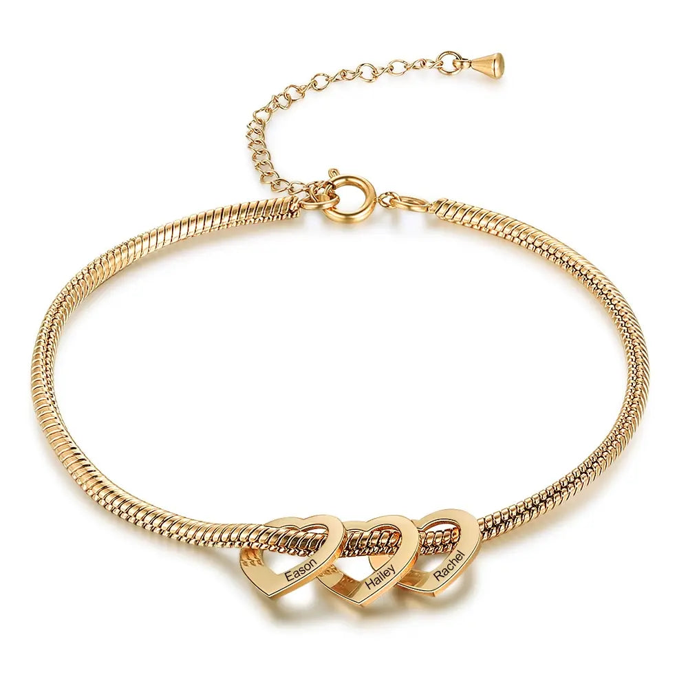 Gold snake chain bracelet with three engraved heart charms
